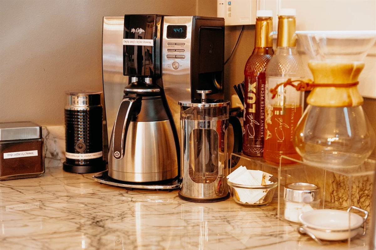 Coffee Lovers Dream! Four different types of brew. Drip, Chemex, French Press & Keurig. Mix-ins & frother  to top off your morning brew.  If nothing here is to your liking, Extra Fine,  a fabulous bakery and coffee shop is directly across the street.