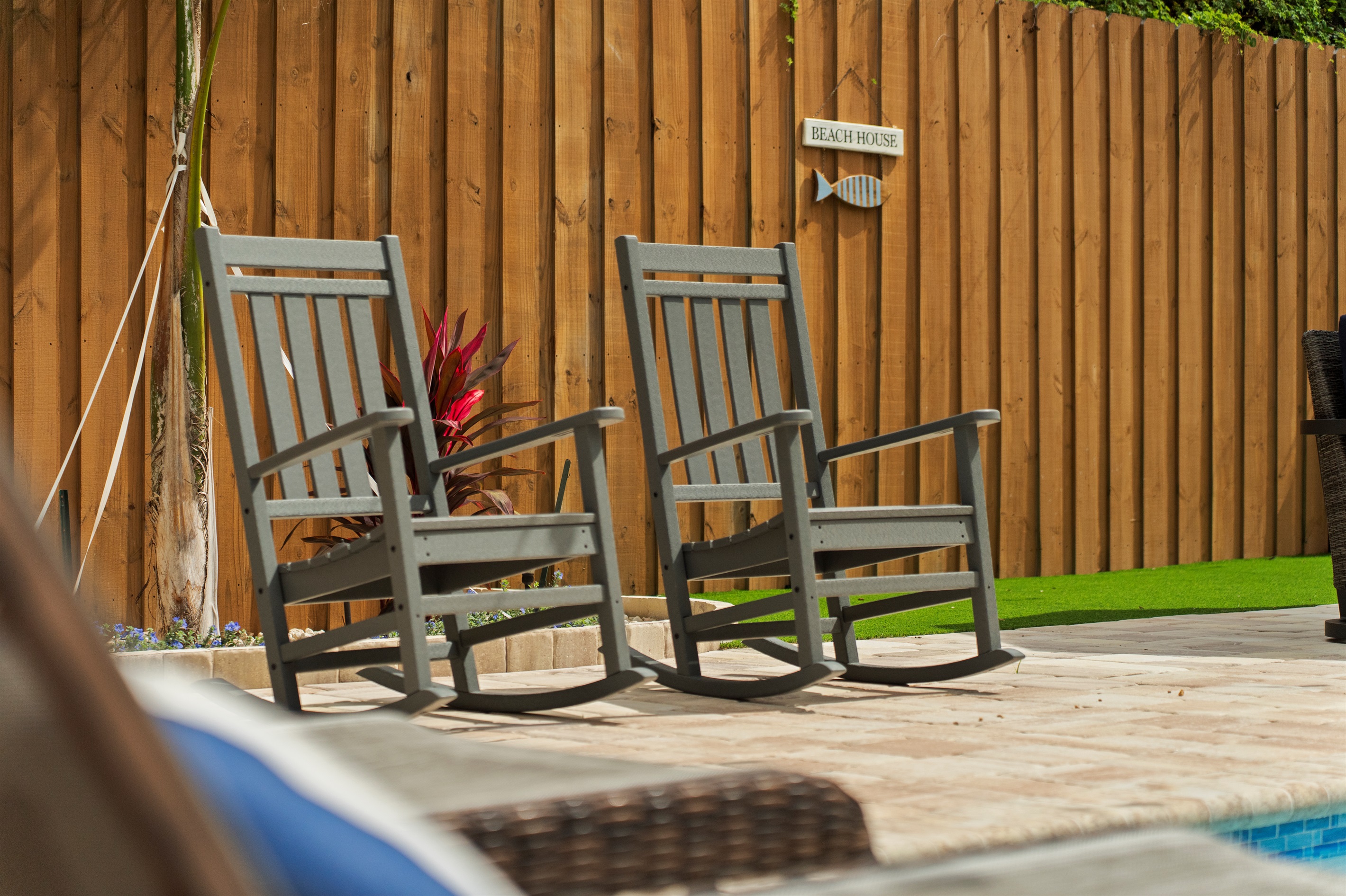 Relax in these outdoor rocking chairs by the pool