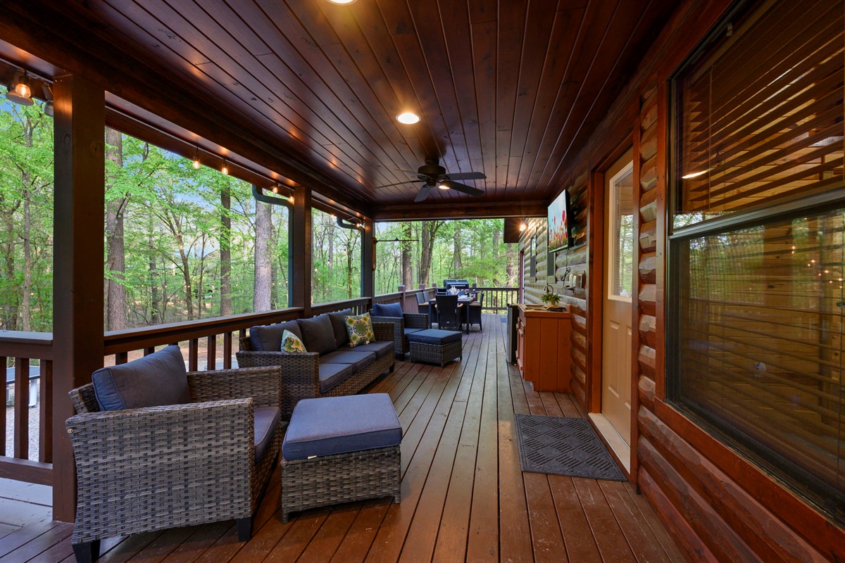 The private back deck offers dining for 6, a gas grill, hot tub, TV and lounge furniture.