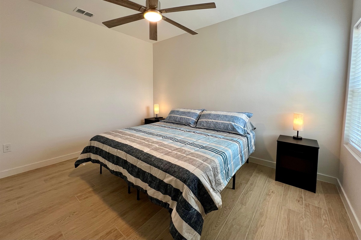 Primary Bedroom with King Bed and SmartTV