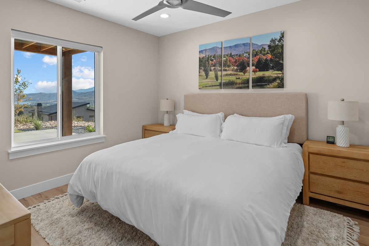 Lower-level bedroom with natural light and shared Jack-and-Jill bath.