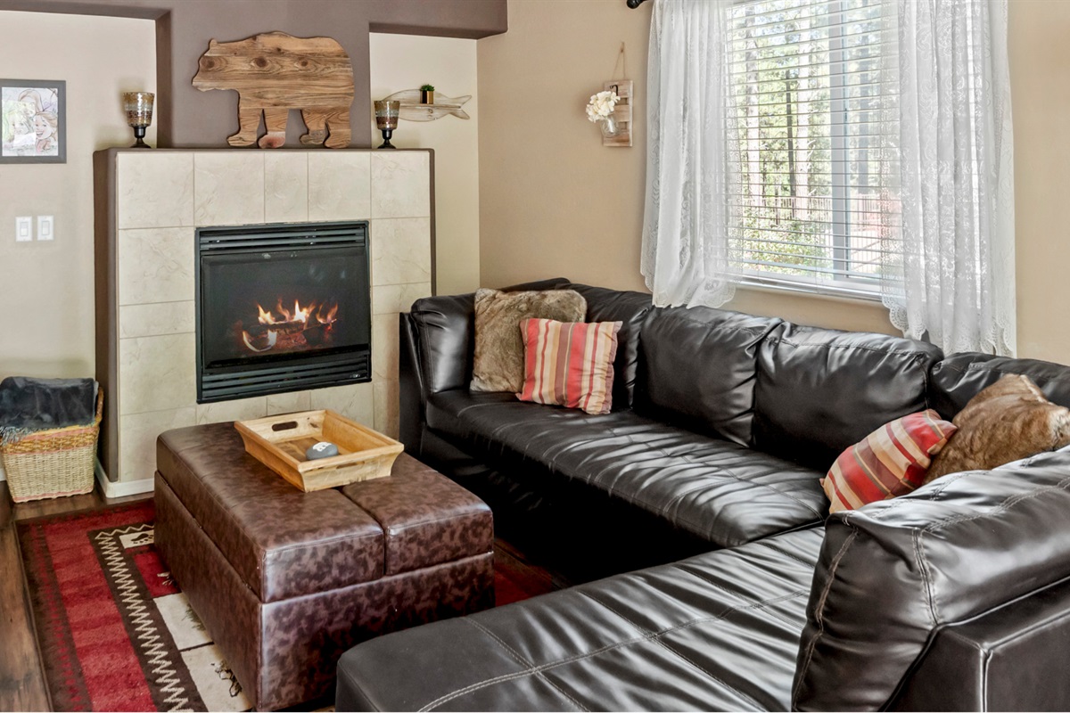 This charming living room provides a relaxed atmosphere, perfect for family game nights or cozying up with a book by the fire.