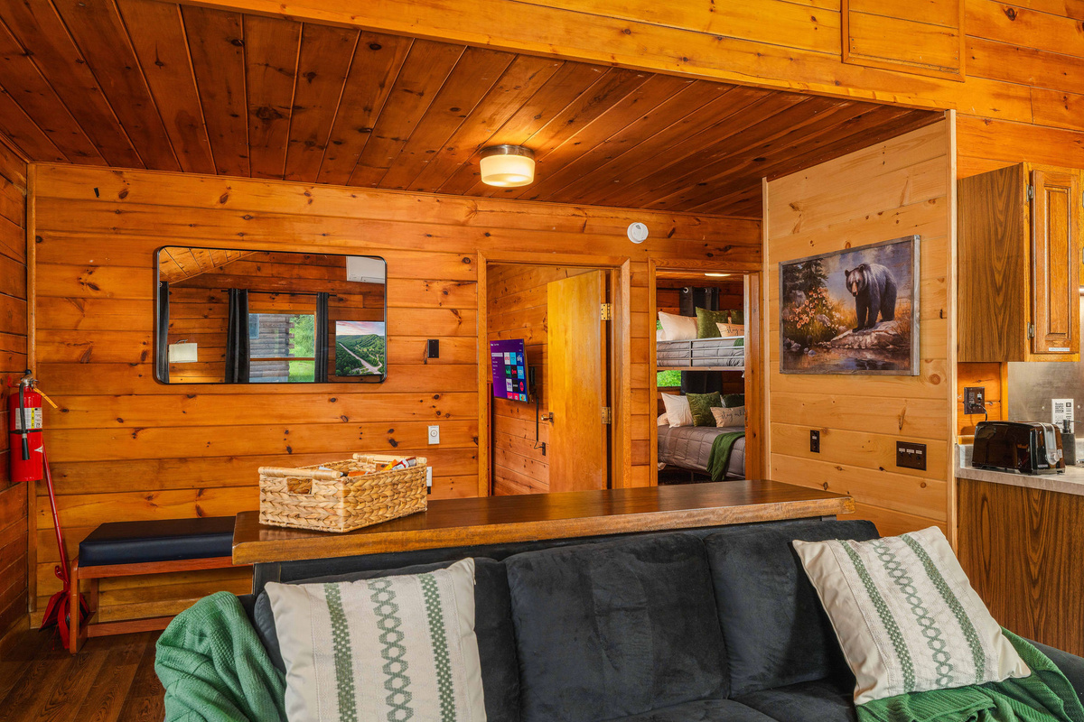 🛋 Living room seats 8 — sofa for 3, bar back for 3, plus 2 side chairs. Room for everyone, plus guests.