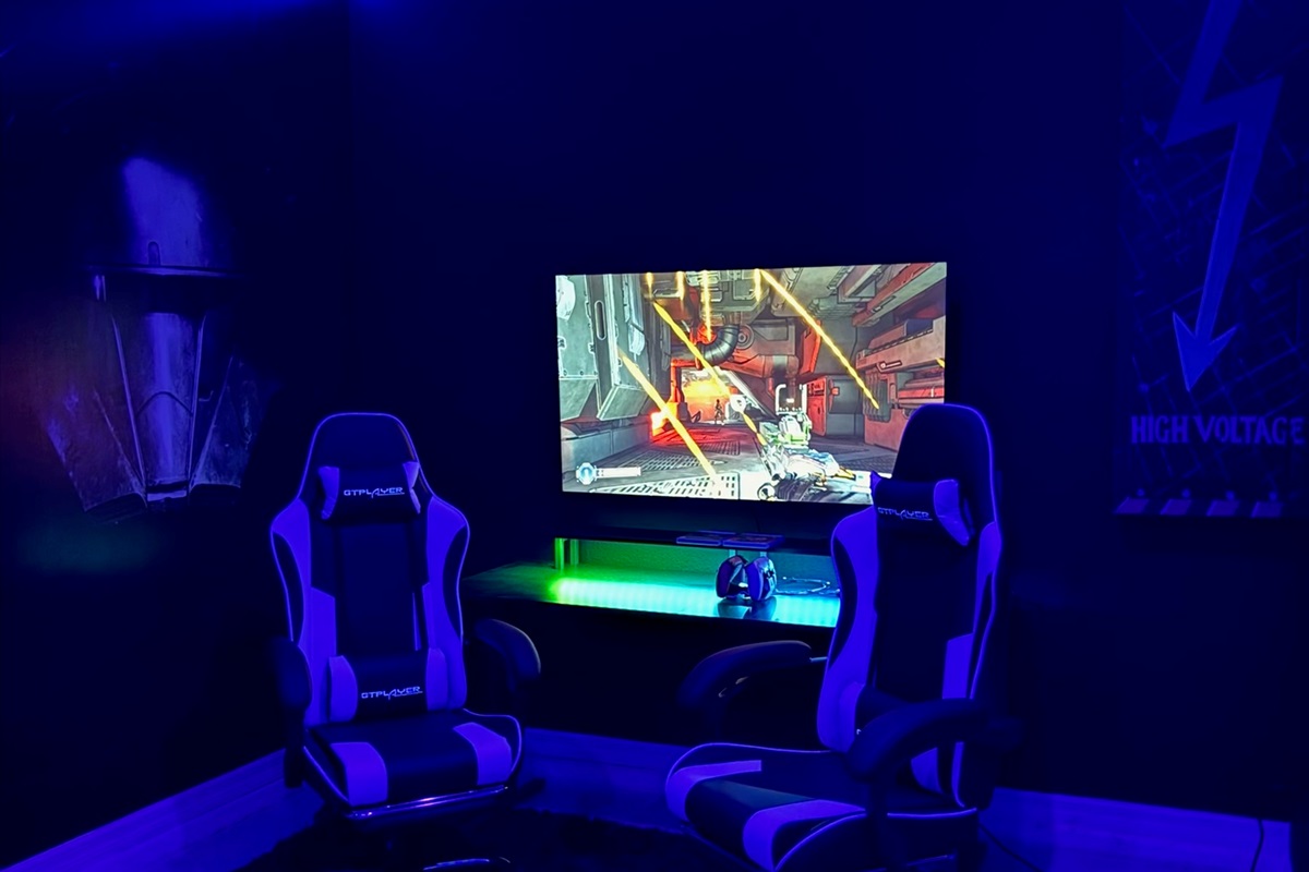 Professional gamer chairs and large-screen TV for next-level entertainment.