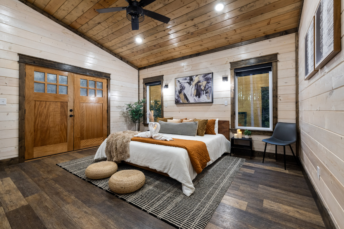 Your own little retreat within the retreat. Sleep in the king bed, watch a movie from under the covers, then open the double doors and step straight onto the deck for a private hot tub soak surrounded by the pines.