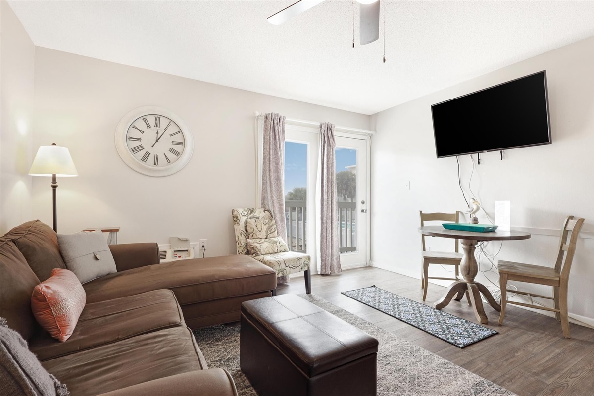 Living Area - The spacious living area features plenty of comfortable seating, and a mounted television for enjoying your down time.