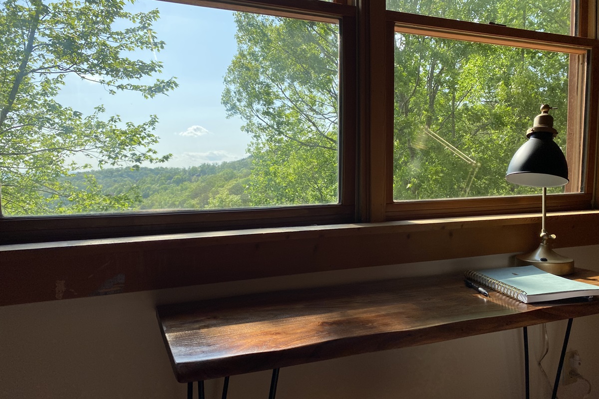 Desk area in the upstairs king bedroom has one of the best views in the cabin. 