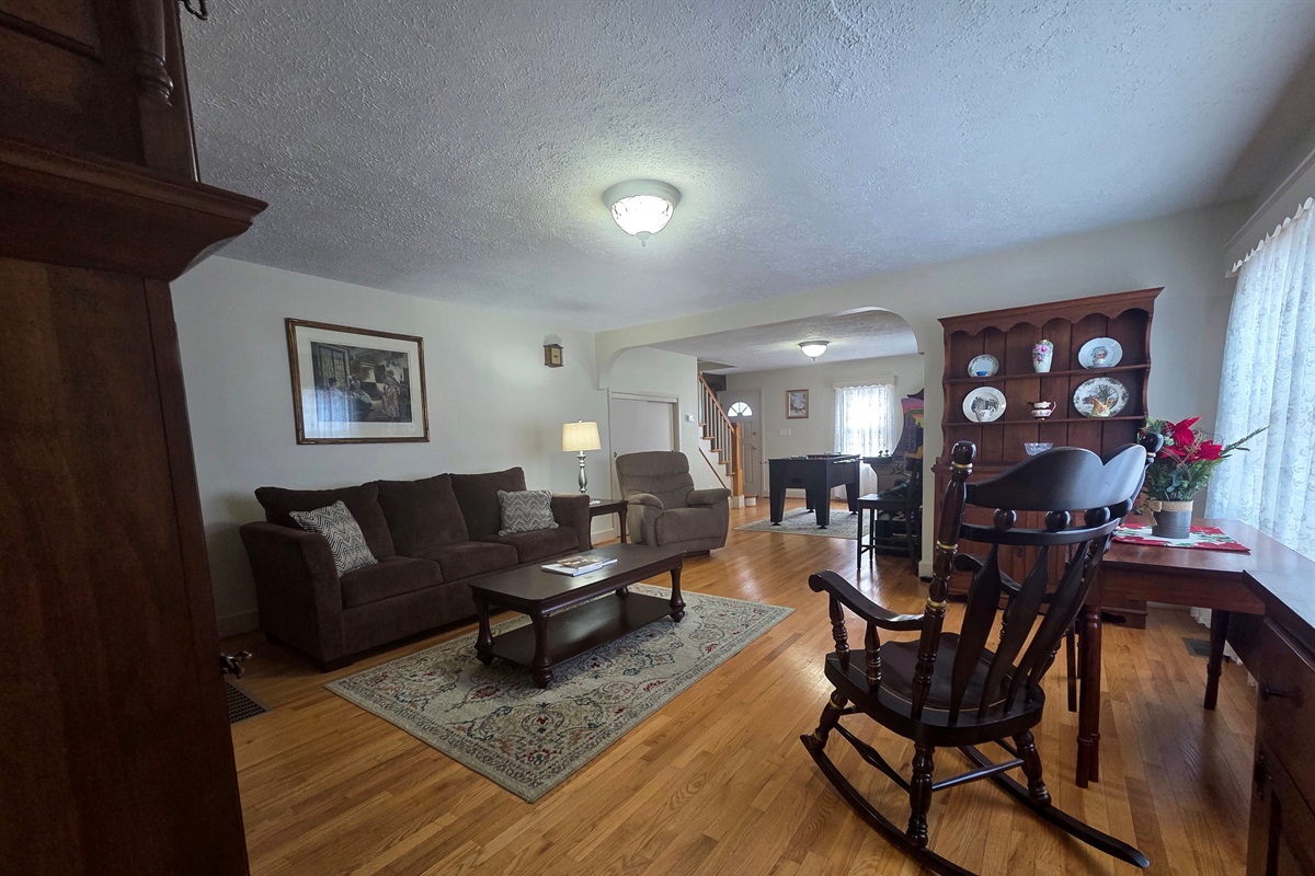 Open-concept sitting room with a dedicated game area.