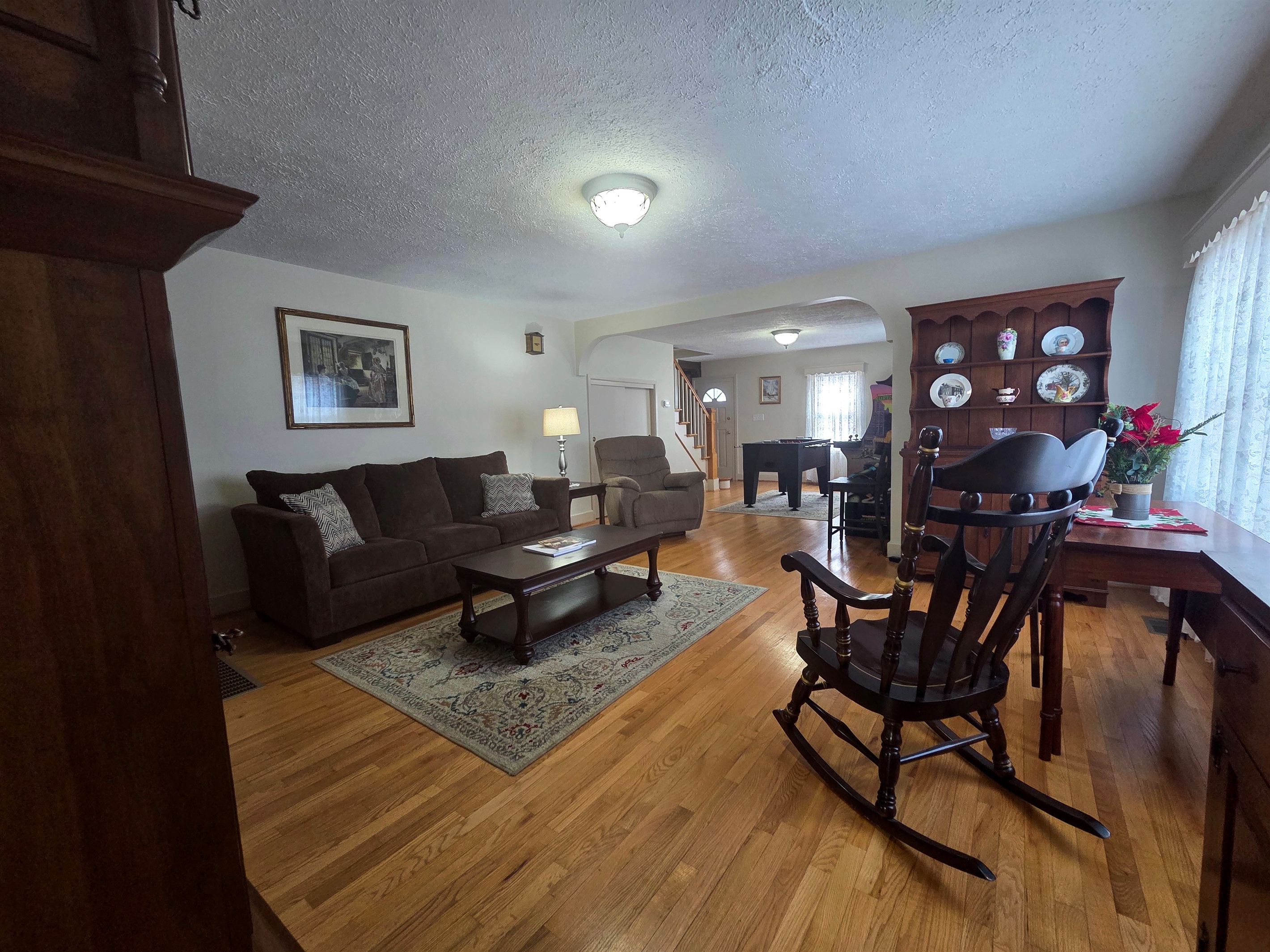 Open-concept sitting room with a dedicated game area.