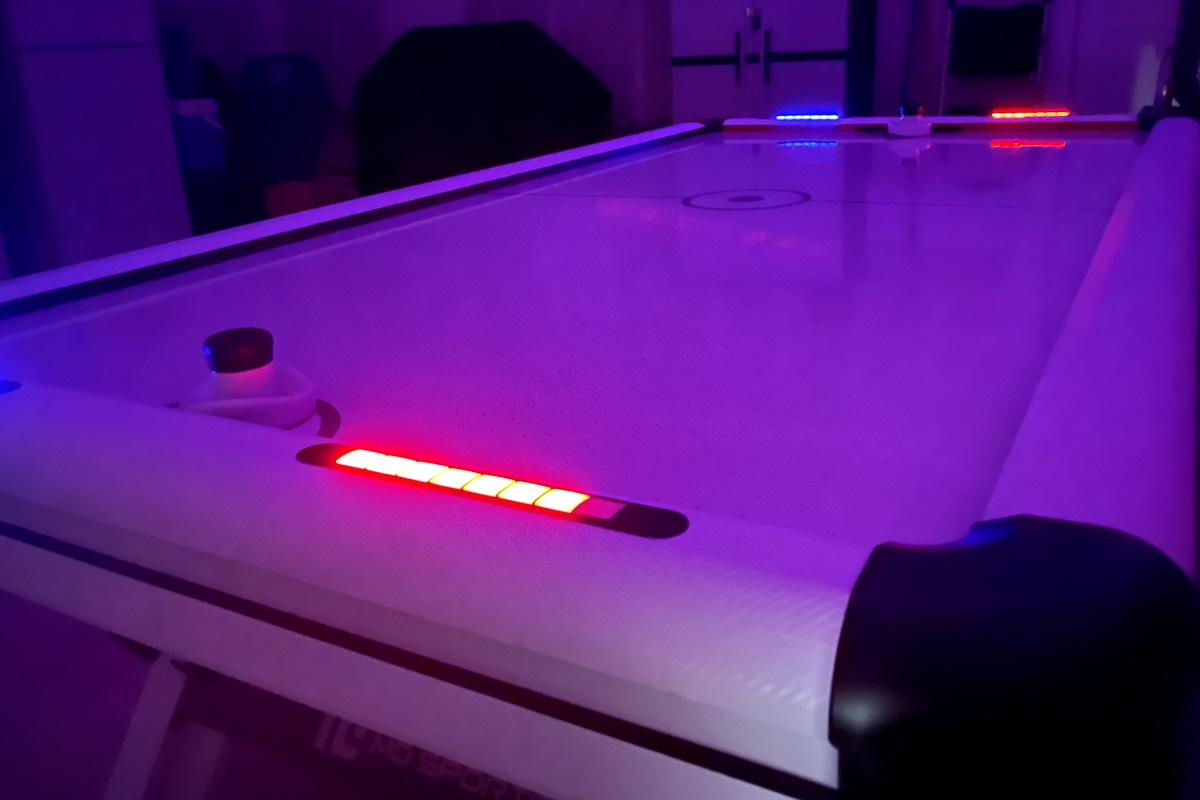 Enjoy a game on the LED air hockey table.