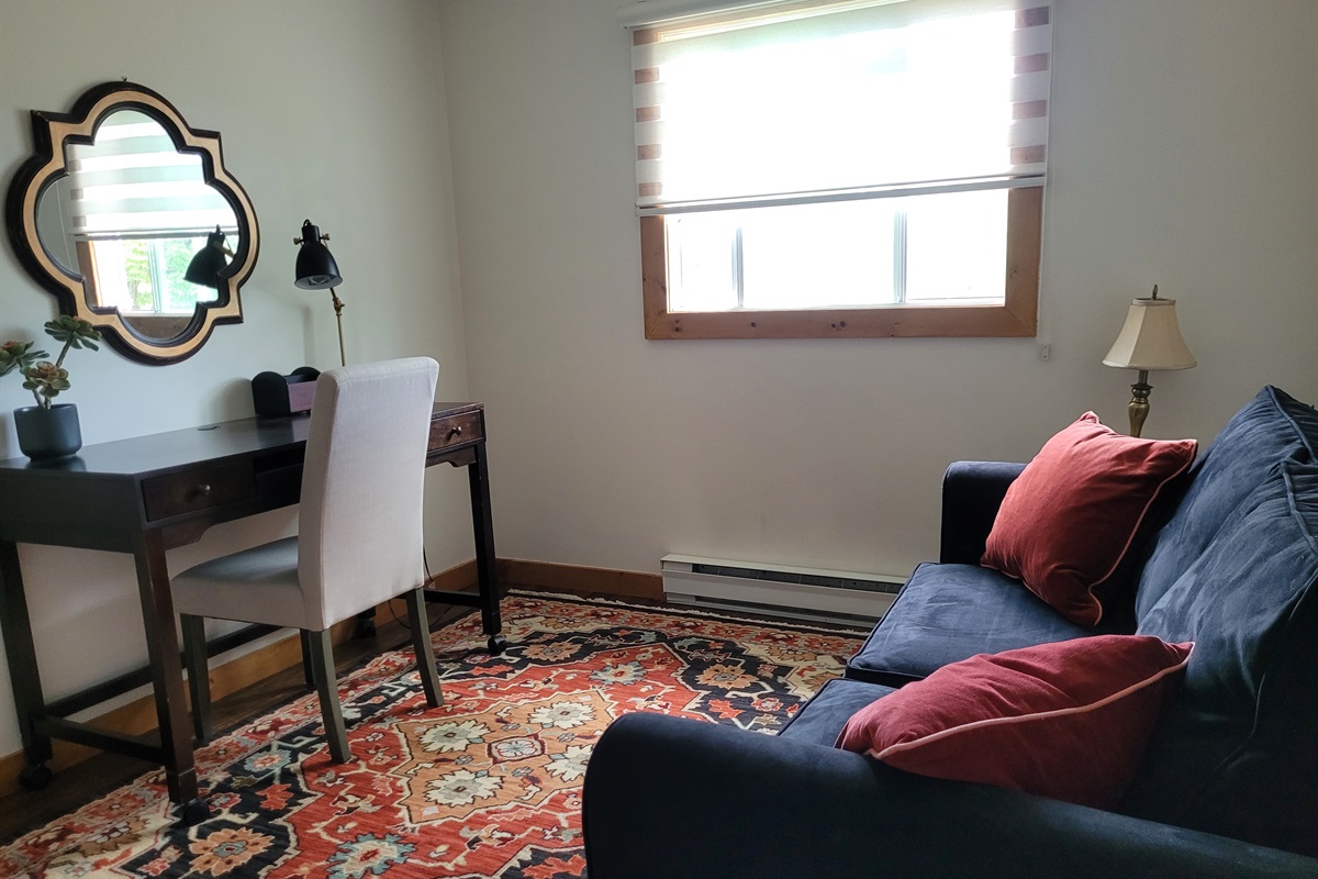Beautifully furnished upstairs office with desk and comfortable couch to get some work done if needed