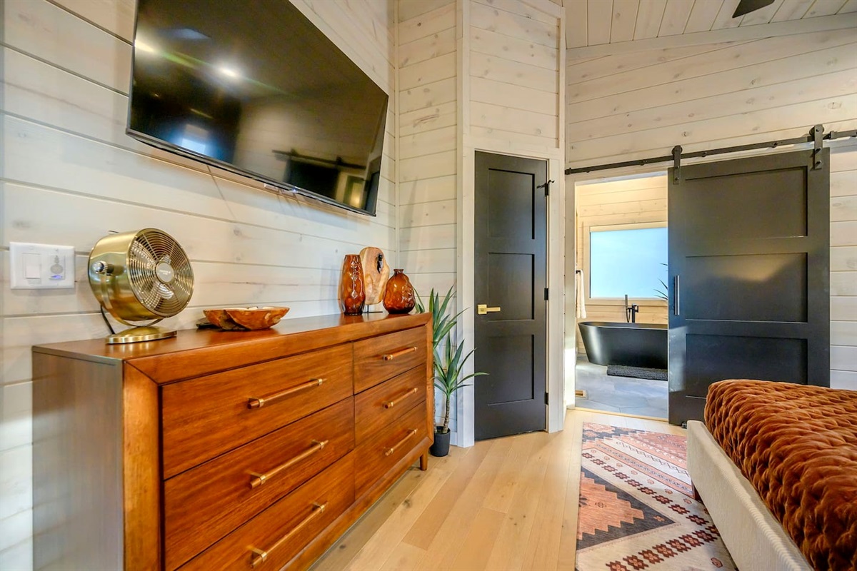 King bedroom has a clothes dresser, closet, plus a 55" TV.