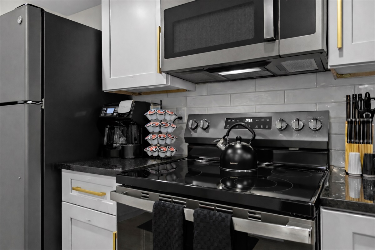 Sleek, fully equipped kitchen with modern appliances, coffee station, and stylish finishes—perfect for easy meals and relaxed mornings at home.