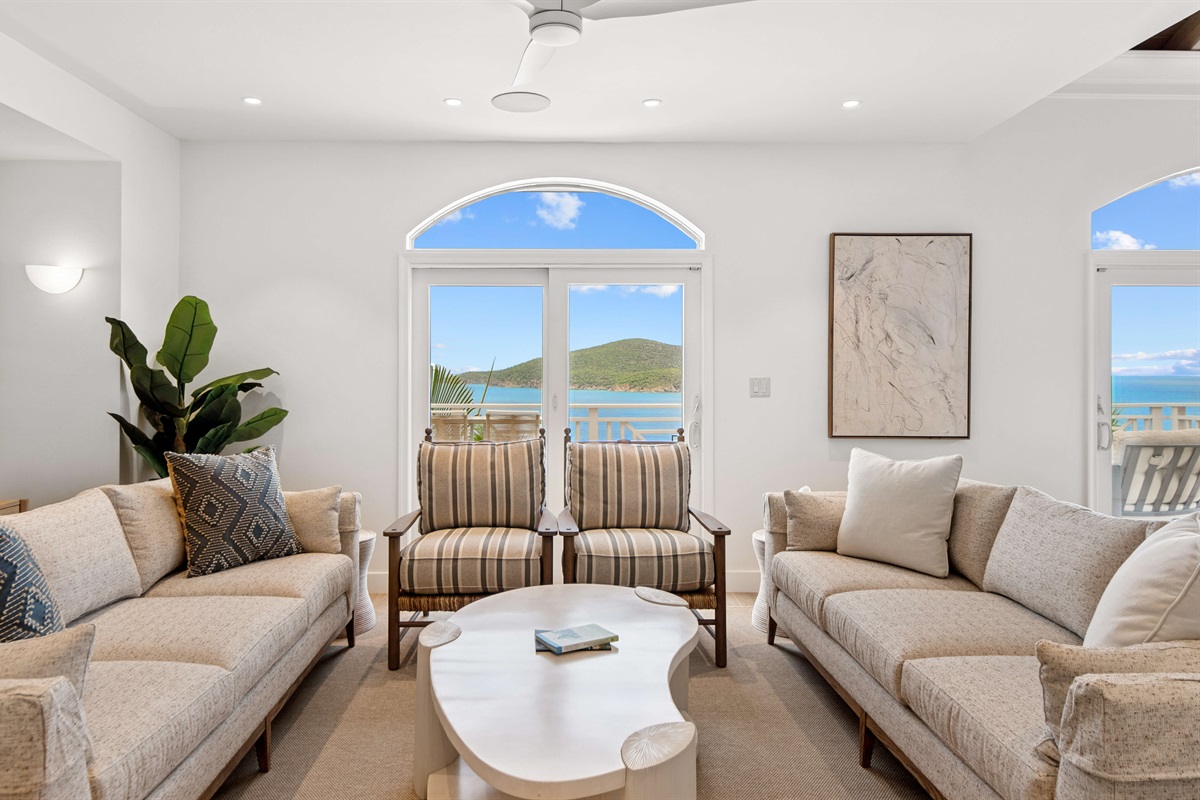 Spacious, ocean-view lounge with vaulted ceilings, Smart TV, board games, and room to unwind. Perfect for lazy mornings or movie nights.