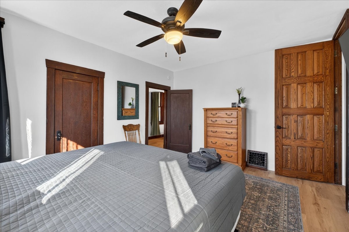 The spacious king first-floor bedroom provides a dresser and TV for your use.