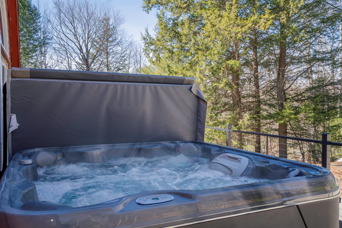 The ultimate mountain luxury: soak your worries away in our sparkling hot tub under the Maine stars.