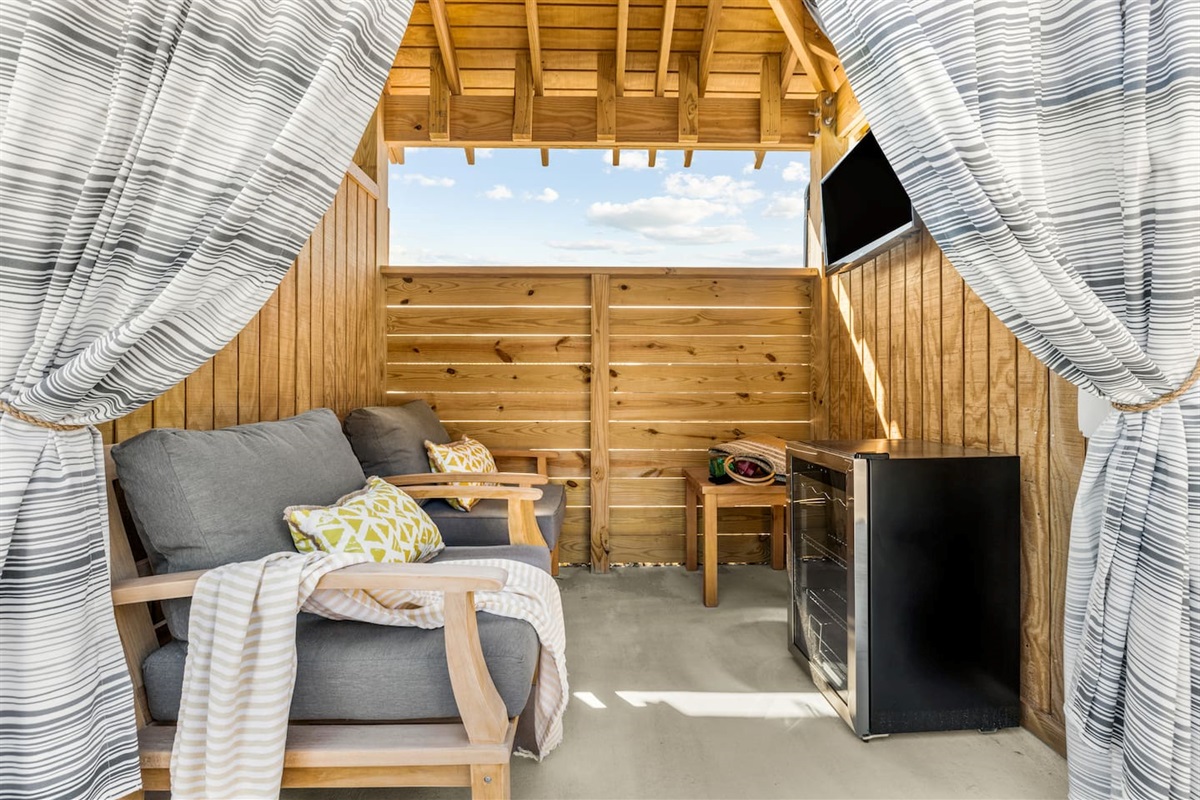 Cozy pool cabana with comfortable lounge seating
