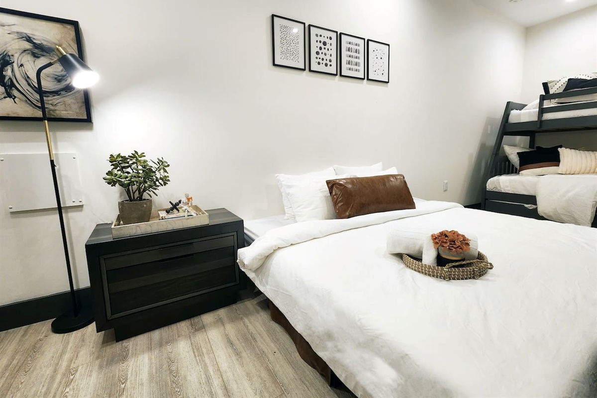 Bedroom with twin over full bunk and trundle with two sleeper chairs that converted into one king bed