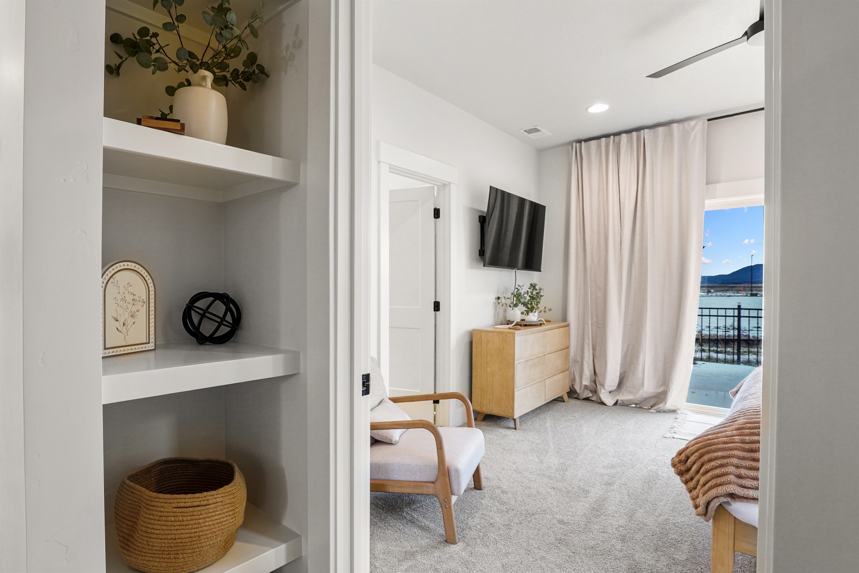 Enjoy comfortable seating and smart storage in this modern suite.