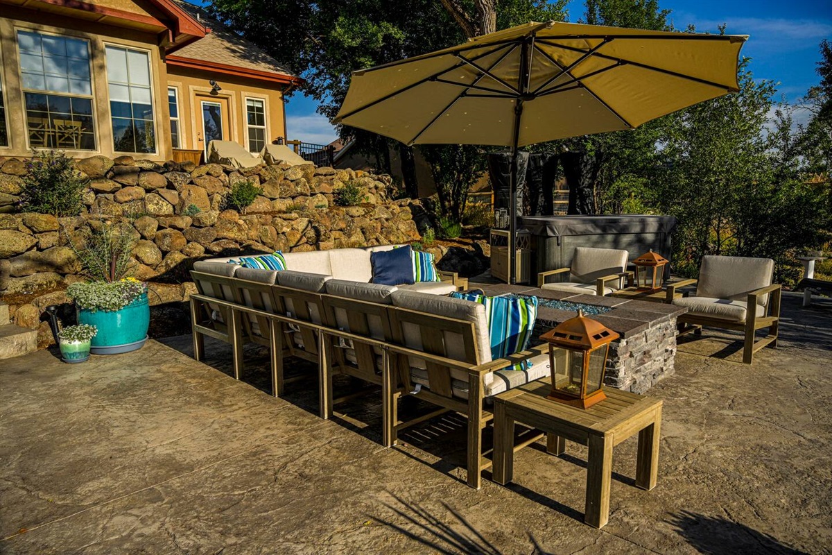 Outdoor seating space, with 8-person luxury therapy spa.