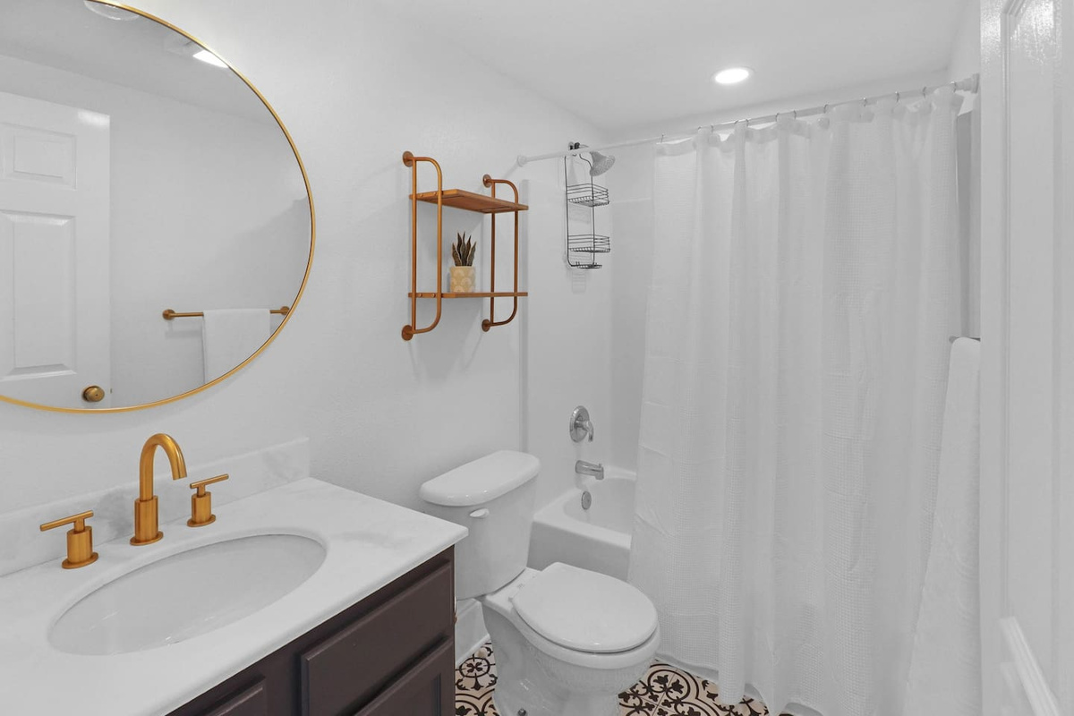  Find everything you need in the main-floor bathroom &mdash; clean, complete, and right where you want it between the beach and the bedroom.