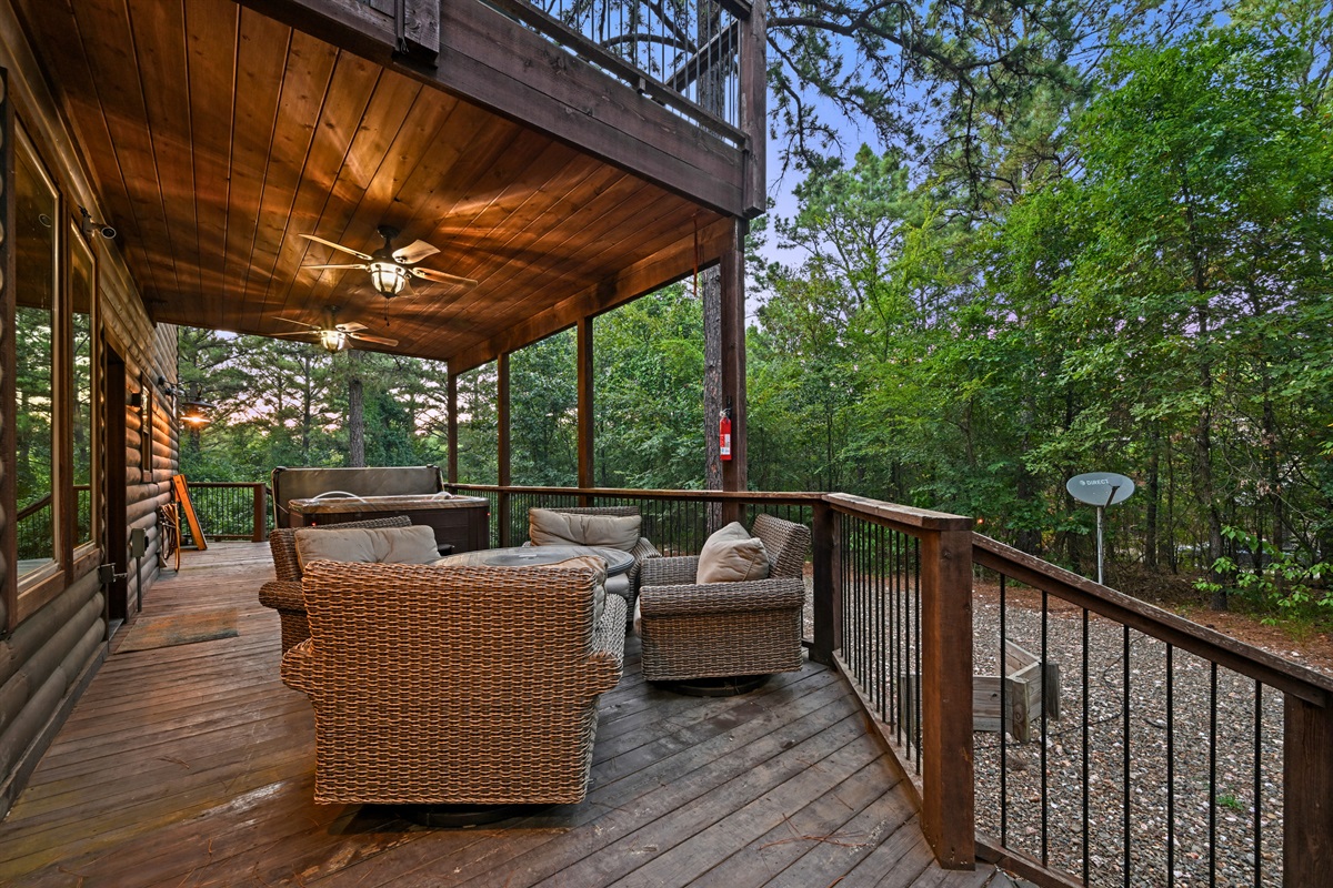Covered outdoor seating offers a cozy spot to sip morning coffee or wind down with a good book as the forest surrounds you.