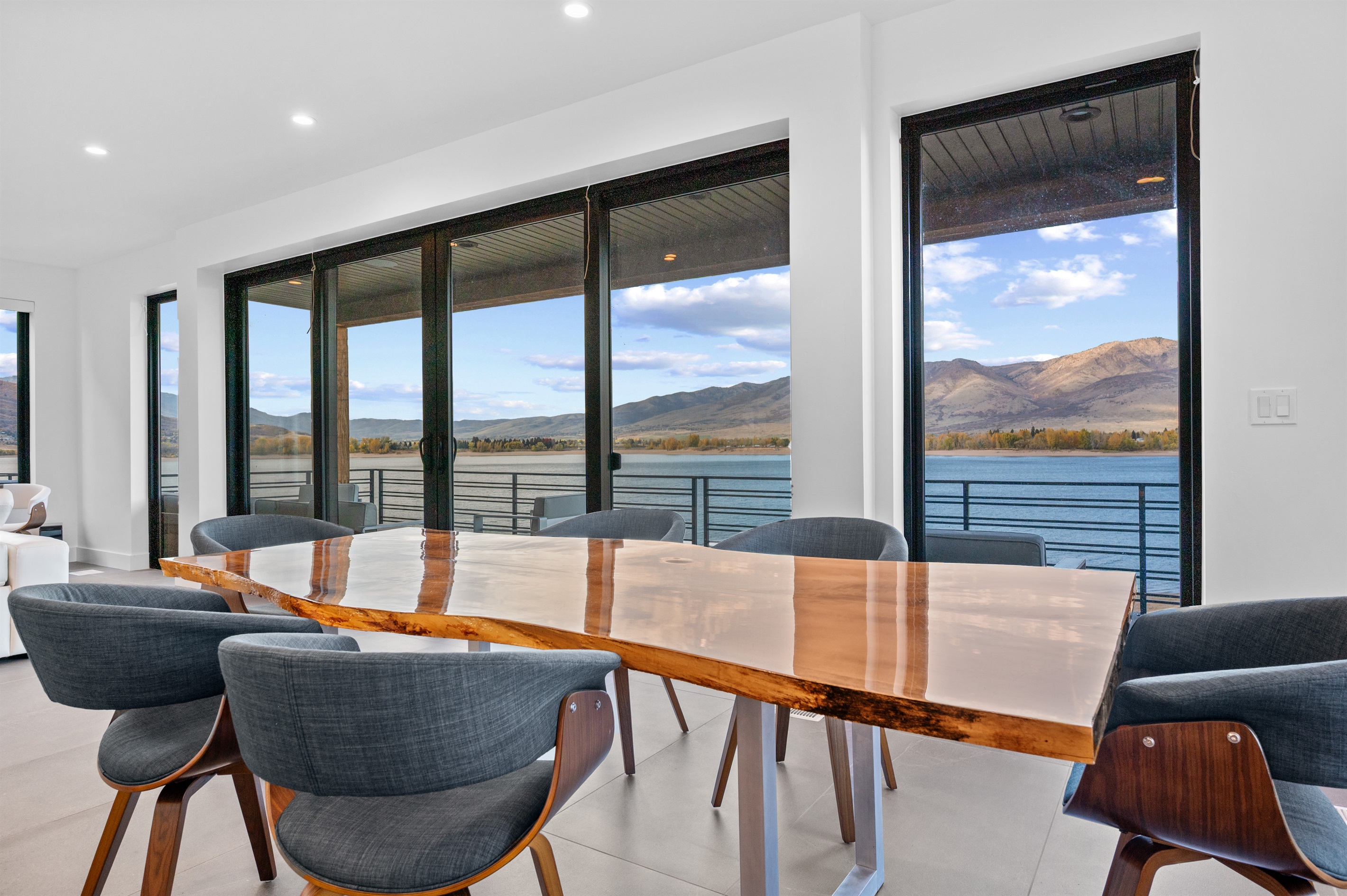 Dining area with lake and mountain views overlooking Pineview Reservoir.