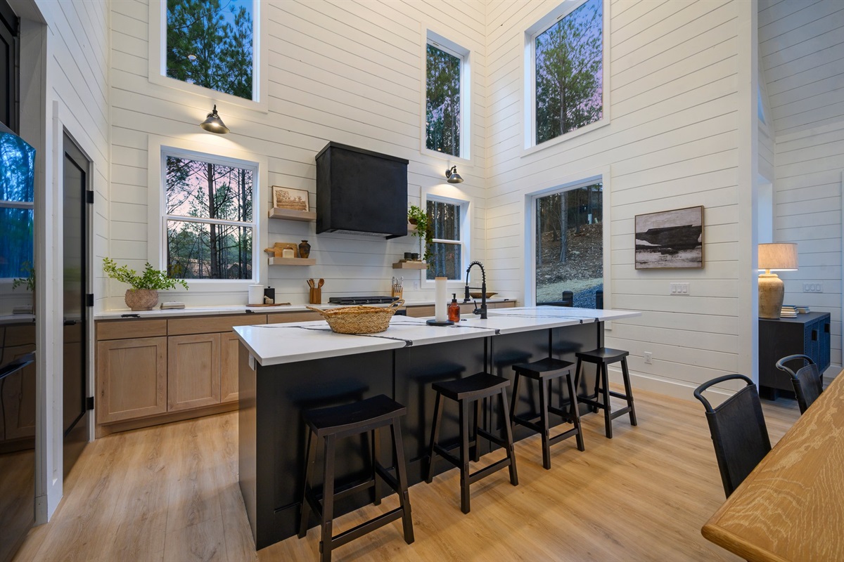 A spacious island with seating makes it easy to gather, prep meals, or enjoy morning coffee together.