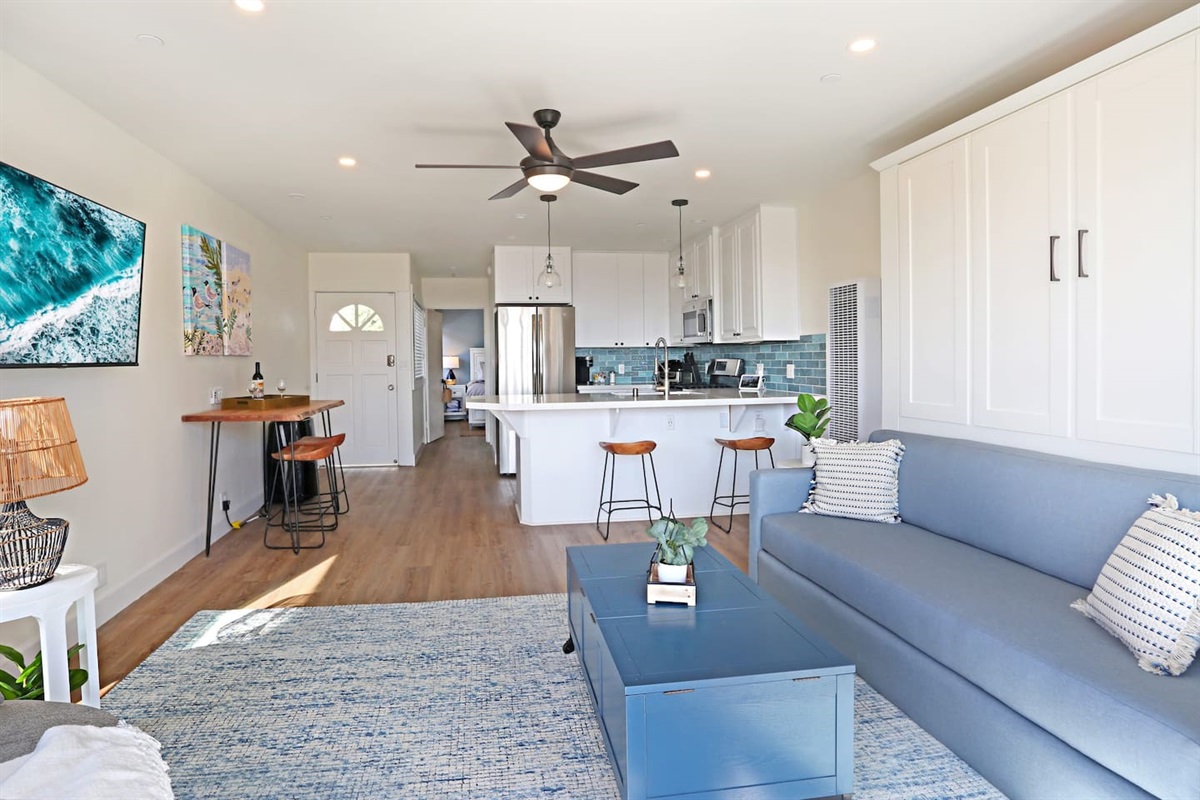 The living room includes a king-sized sofa Murphy Bed that converts to a "real bed" in less than one minute.  The bed is made up with bedding ready for sleep.  This murphy bed makes this 1 bedroom condo feel more like a 2 bedroom.