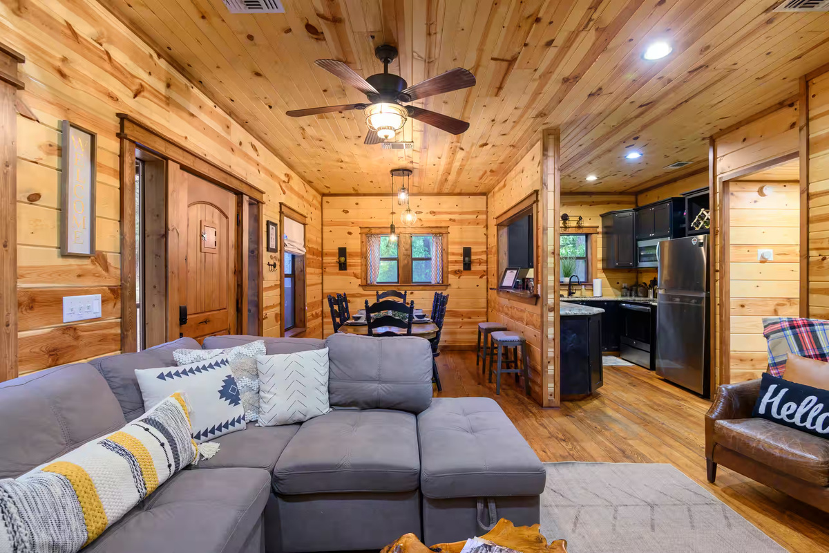 Living Room: Modern comfort meets rustic charm with inviting seating and warm wood accents!