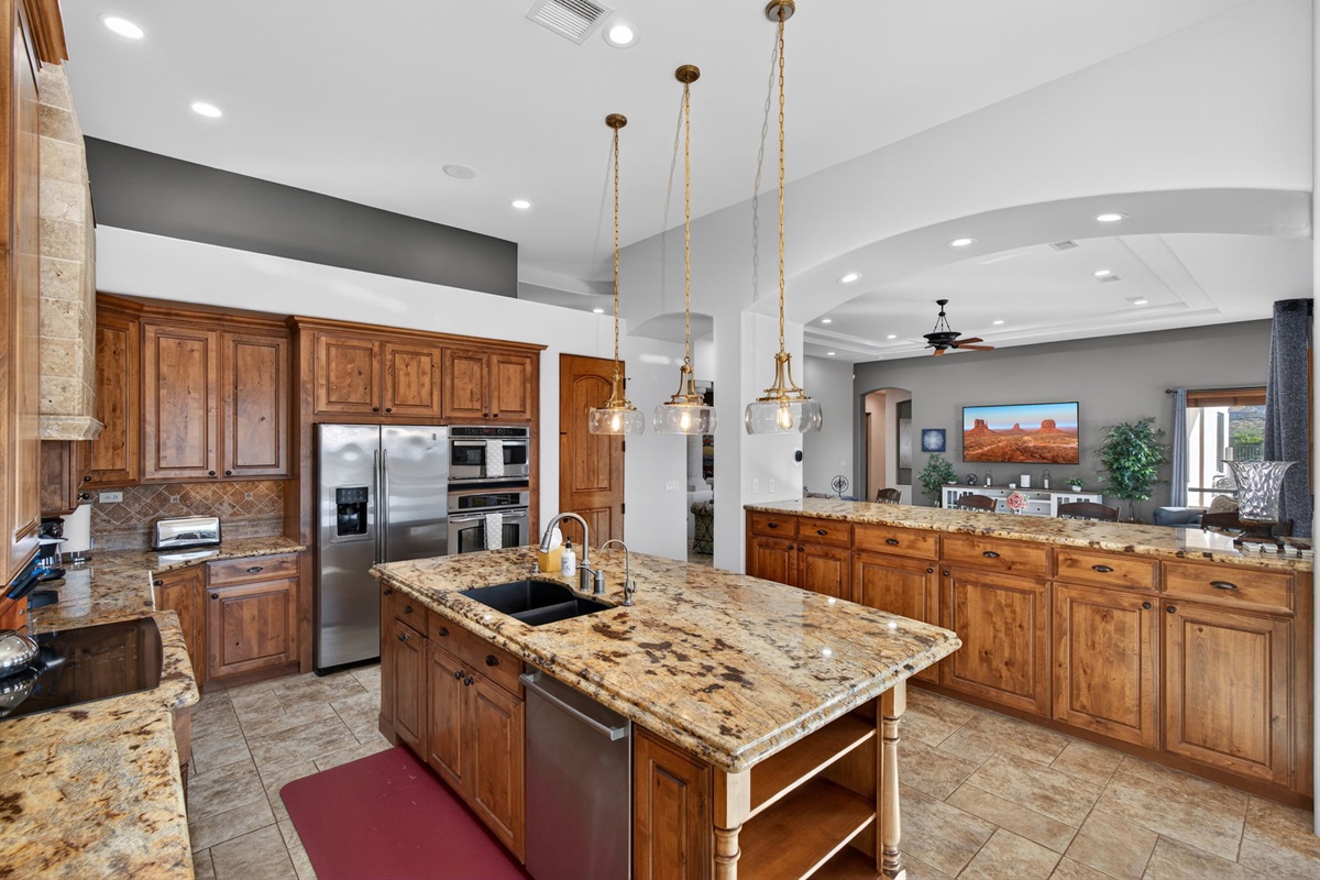 Spacious open kitchen layout with oversized prep areas makes hosting and cooking together easy and enjoyable