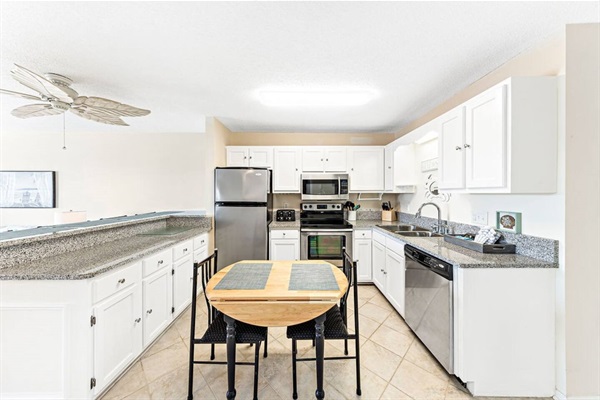 Lots of counter space with breakfast bar seating four people