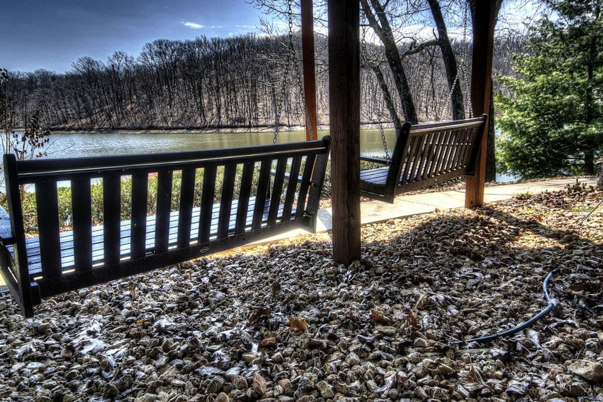 Shaded lake side porch swings