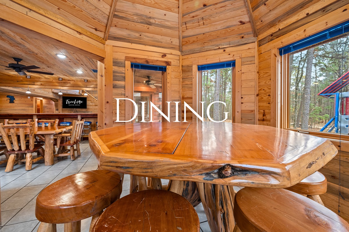 Centered beneath warm wood ceilings, the dining table becomes a natural gathering place for shared meals, board games, and long conversations.