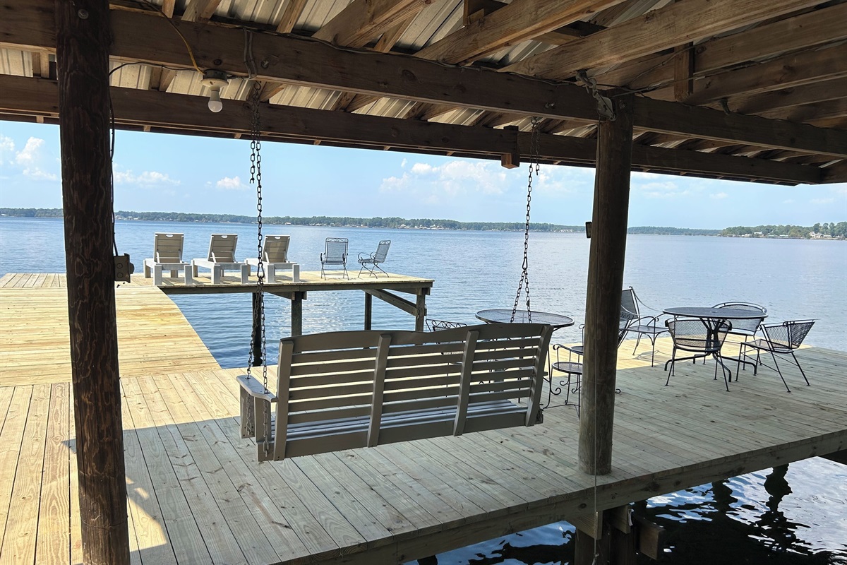 Large single slip boathouse with plenty of seating area.   Power and lights.