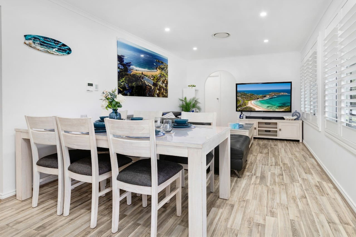 Skye’s Beach House includes an upstairs dining area close to the kitchen, with a simple layout for meals on the main level.