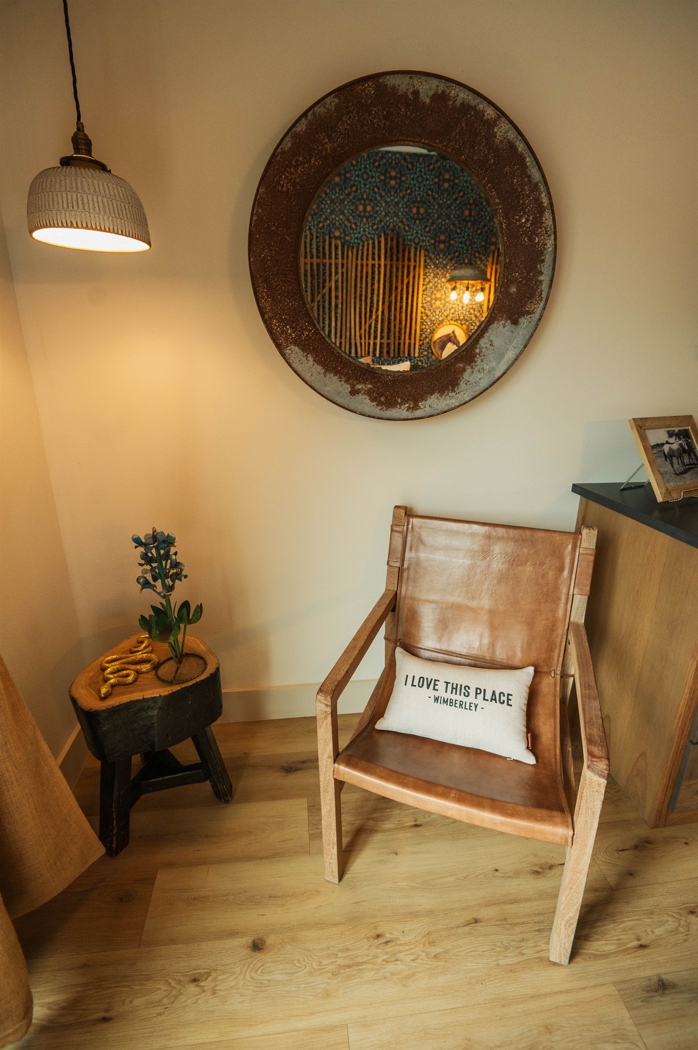  A warm welcome inside the Corral Suite — a handcrafted seating corner and thoughtful Hill Country touches at Gaines Ranch on the Square.