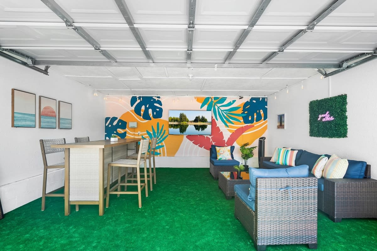 The tiki bar, with the stools pulled up and that painted mural running along behind. Somebody appoints themselves barman on the very first night, and the role tends to stick for the rest of the holiday.