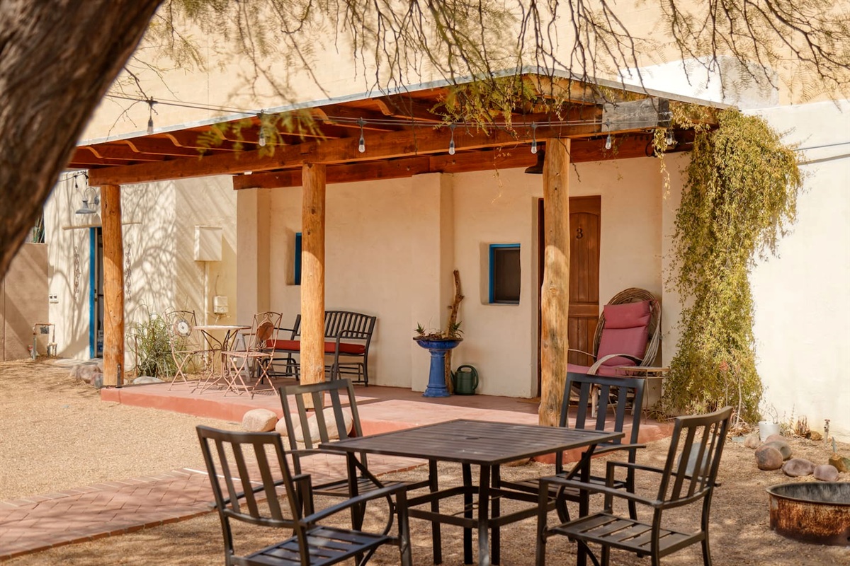 Outside dining area with grill and fire pit