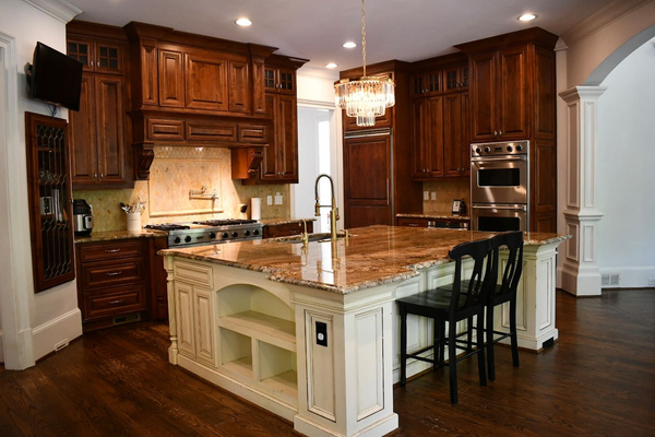 This spacious and thoughtfully designed chef's kitchen boasts high-end appliances including a professional Viking gas stove, double ovens, and a large refrigerator with ample storage for all your ingredients. Marble island and countertops.