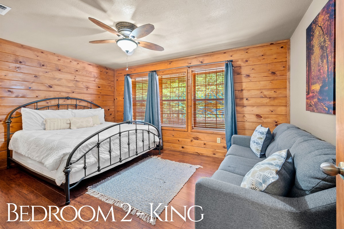 Second king bedroom with cozy sitting area and lots of windows.