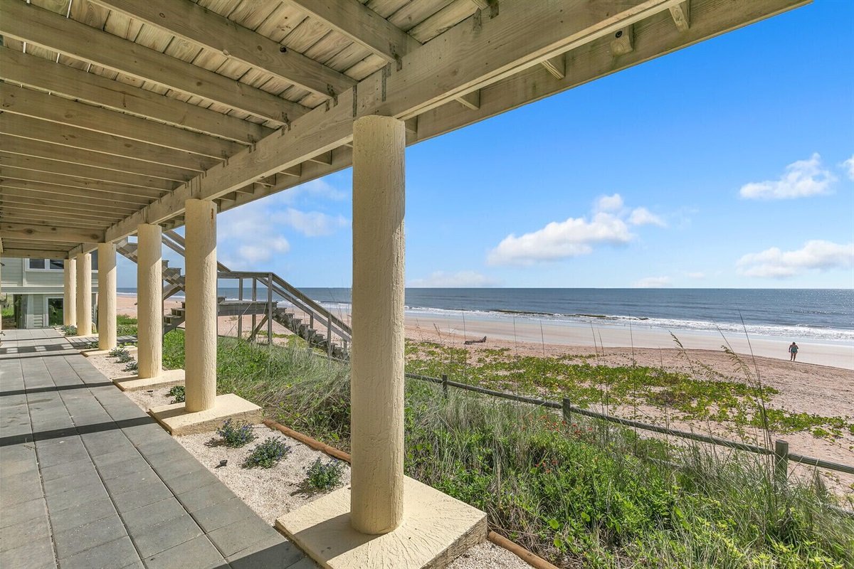 Walkway on ground floor has an outdoor shower