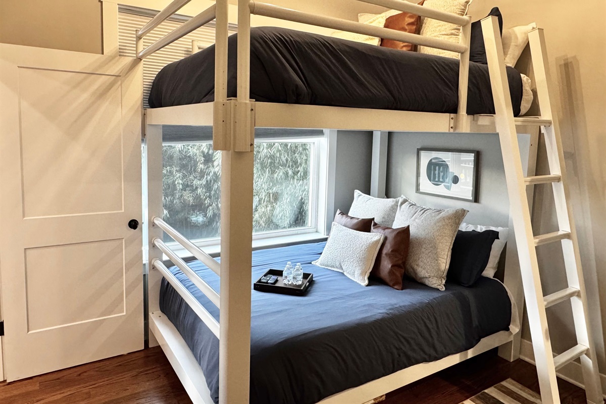 Queen over queen bunk beds provide space for 4.