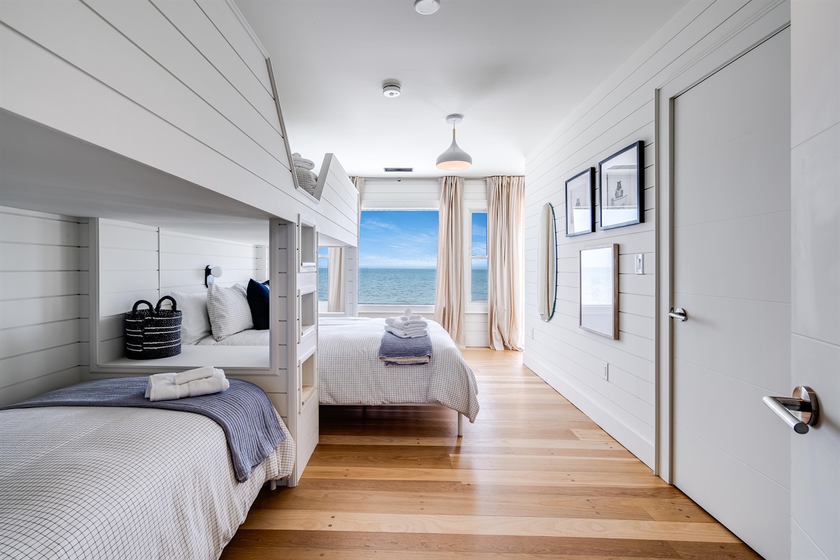 Bedroom with 3 twins, and 1 Queen bed. 