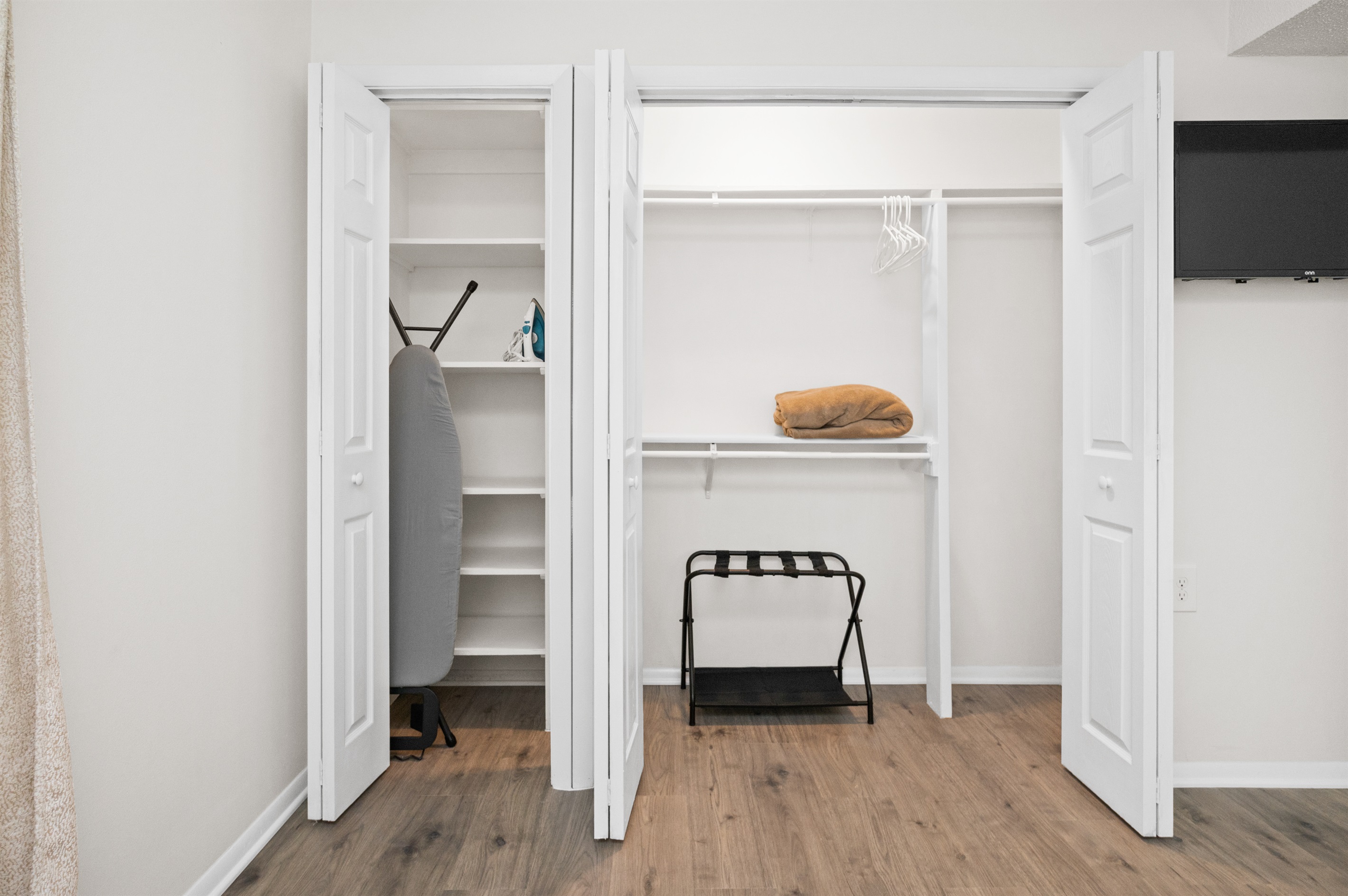 Straight on view of the spacious linen closet and clothes closet in the king bedroom. Plenty of space!