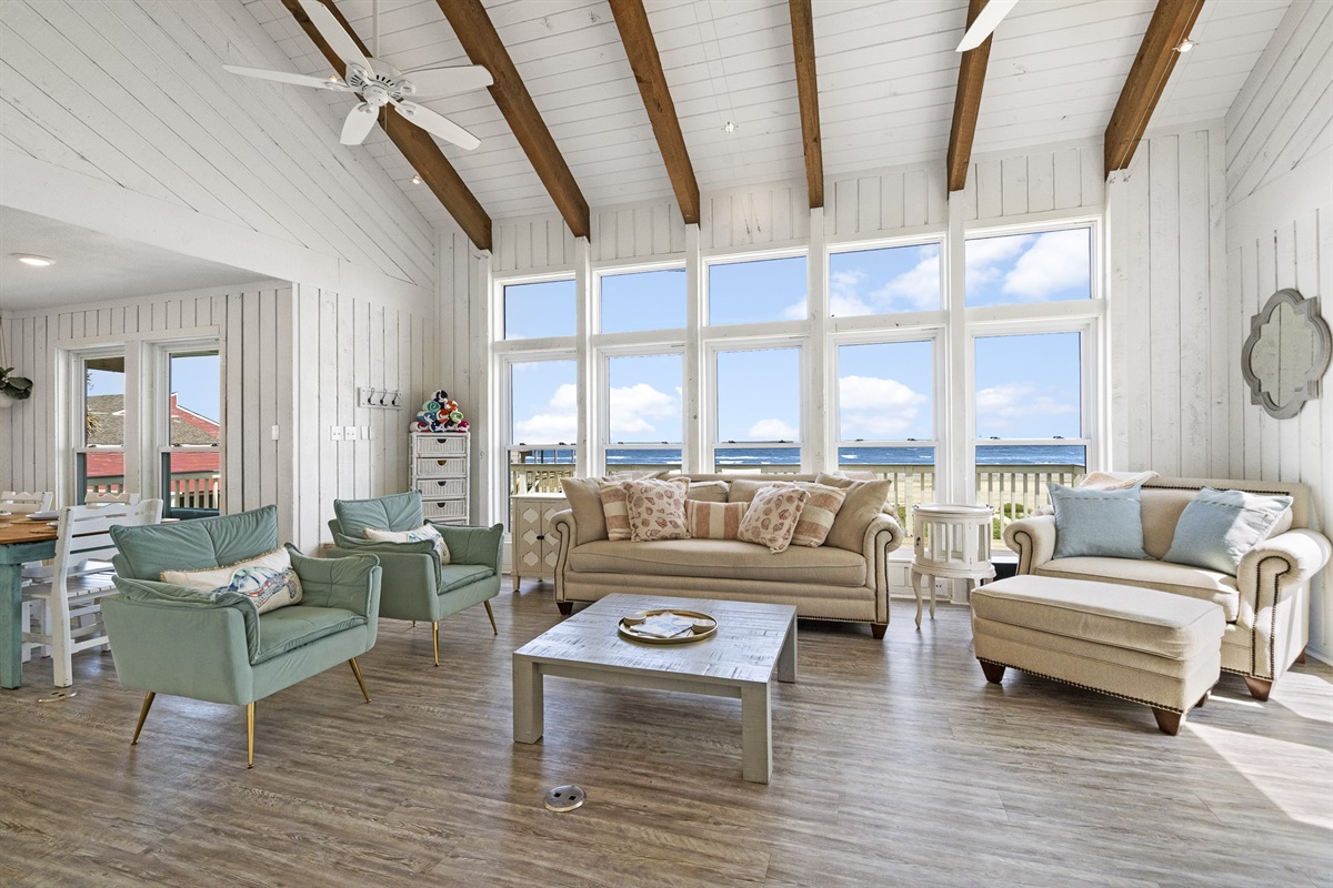 The living room boasts endless gulf views through floor-to-ceiling windows!
