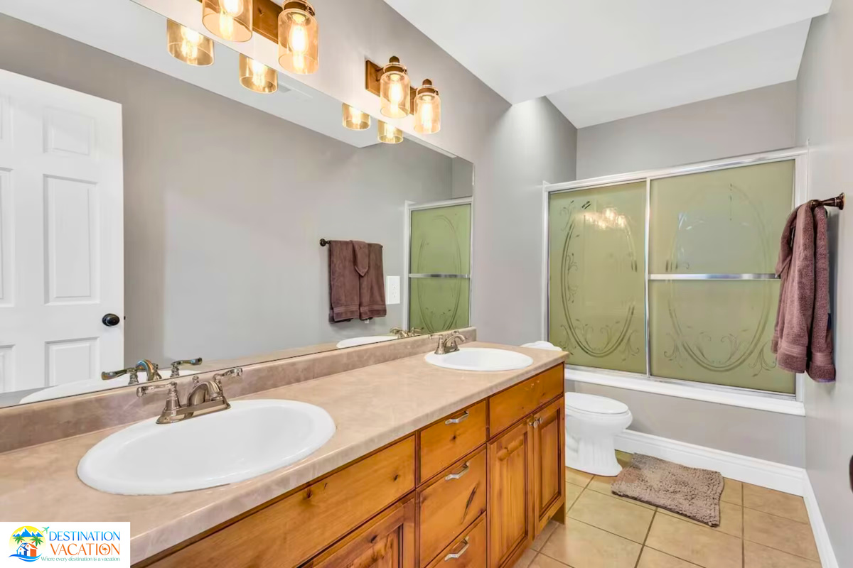 Spacious bathroom blends comfort, style, and natural light.