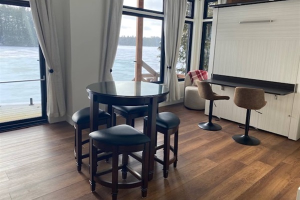 Bedroom 3 showing Queen murphy bed stored in wall with Workspace area on bed back