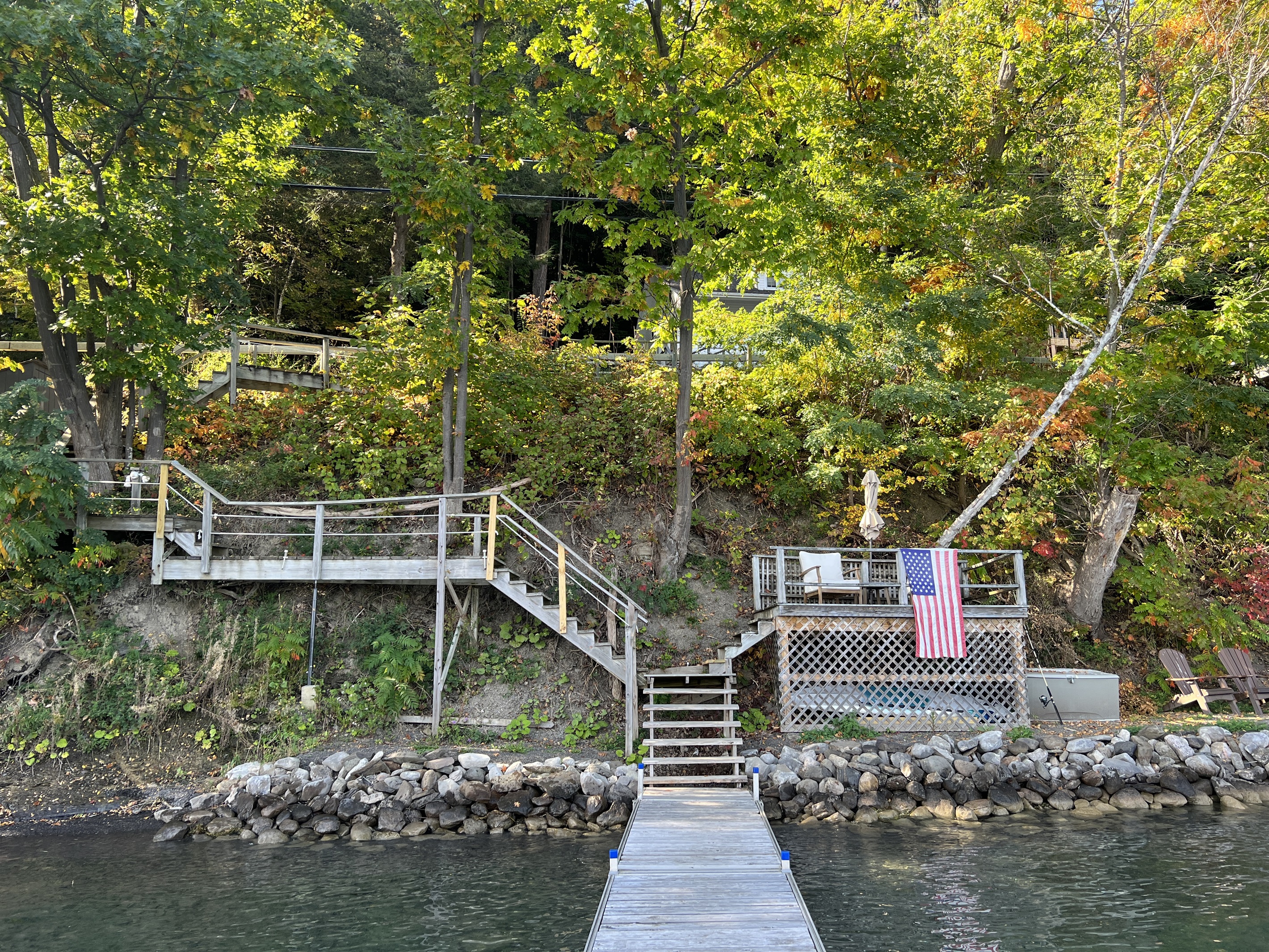 Lille Gossebo private Otsego lake waterfront with sitting area and firepit.