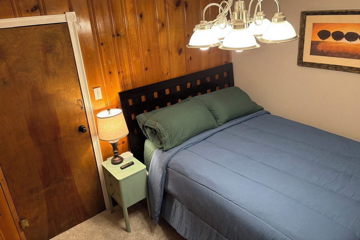Super comfortable queen bed, lamp and convenient charging ports.
